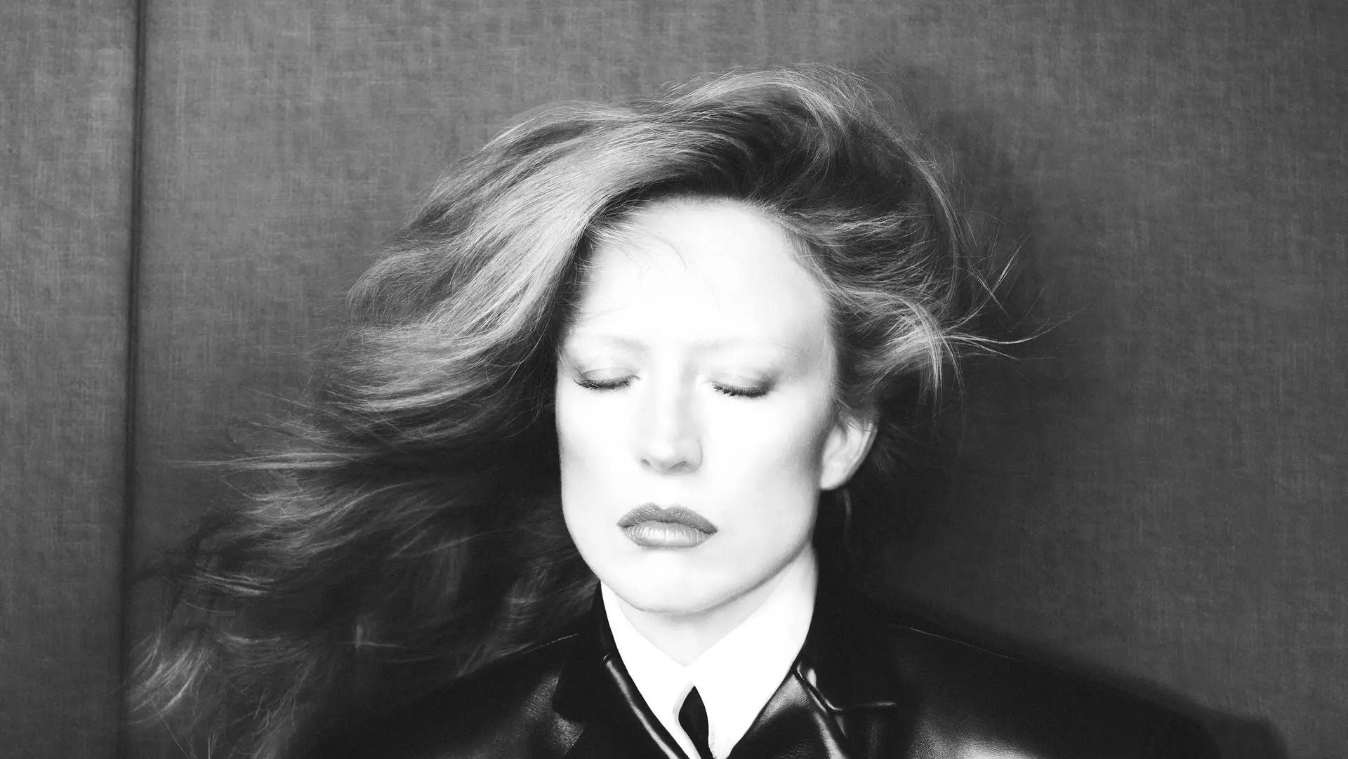Portrait, hair in motion, black leather collar